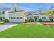 Inviting home with lush green lawn, a two-car garage, and charming curb appeal at 521 Yellow Tower Ter, Charleston, SC 29412