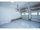 Spacious, epoxy floor garage with storage racks and an automatic door system, ready for use at 521 Yellow Tower Ter, Charleston, SC 29412