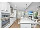 Well-appointed kitchen flowing into the living space, featuring modern appliances and a large central island at 521 Yellow Tower Ter, Charleston, SC 29412