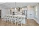 Spacious open-concept kitchen featuring a large island with seating, stainless steel appliances, and pendant lighting at 521 Yellow Tower Ter, Charleston, SC 29412