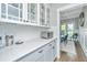 Bright kitchen with white cabinets, marble countertops, subway tile backsplash, and stainless steel appliances at 521 Yellow Tower Ter, Charleston, SC 29412
