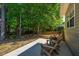 View of the lush backyard and relaxing patio seating area at 522 Antebellum Ln, Mount Pleasant, SC 29464
