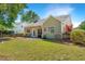 Spacious backyard with a patio, lush green lawn, mature trees, and privacy, perfect for outdoor entertaining and relaxation at 522 Antebellum Ln, Mount Pleasant, SC 29464