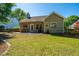 Well-maintained backyard and patio of home with lush green lawn at 522 Antebellum Ln, Mount Pleasant, SC 29464