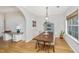 Dining area with a dark wooden table, chairs, and a light blue cabinet under hanging light at 522 Antebellum Ln, Mount Pleasant, SC 29464