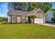 Charming single-story home with manicured lawn, fresh mulch, mature landscaping, and a two car garage at 522 Antebellum Ln, Mount Pleasant, SC 29464