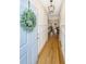 Bright foyer with hardwood floors and classic wainscoting welcomes you inside at 522 Antebellum Ln, Mount Pleasant, SC 29464