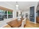 Bright kitchen with white cabinetry, granite countertops, stainless appliances, and adjoining dining area with decor at 522 Antebellum Ln, Mount Pleasant, SC 29464