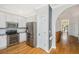 White kitchen with stainless steel appliances and view into hall at 522 Antebellum Ln, Mount Pleasant, SC 29464