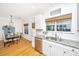Bright kitchen featuring white cabinets, granite countertops, and stainless steel appliances and adjacent dining space at 522 Antebellum Ln, Mount Pleasant, SC 29464