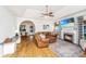 Cozy living space with fireplace, TV, and comfortable furniture arrangement and an arched doorway at 522 Antebellum Ln, Mount Pleasant, SC 29464