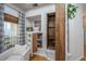 Charming living room with built-in shelving, window, and cozy chair, offering a relaxing and inviting atmosphere at 522 Antebellum Ln, Mount Pleasant, SC 29464
