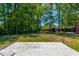 A large backyard features a fire pit, storage sheds, and plenty of room to relax and play at 523 Bayshore Blvd, Goose Creek, SC 29445