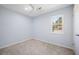 Light-blue bedroom features plush carpet, ceiling fan, window overlooking green outdoor space at 523 Bayshore Blvd, Goose Creek, SC 29445
