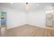 Bright bedroom boasts wood-look flooring, adjacent bathroom, and fresh neutral paint at 523 Bayshore Blvd, Goose Creek, SC 29445
