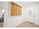 Entryway with coat rack and front door with decorative oval window at 523 Bayshore Blvd, Goose Creek, SC 29445
