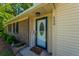 Charming front door with a welcome sign and vibrant flower bed at 523 Bayshore Blvd, Goose Creek, SC 29445