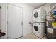Laundry room includes stacked washer/dryer unit and water heater, plus storage space at 523 Bayshore Blvd, Goose Creek, SC 29445