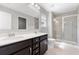 Bathroom featuring double sinks, and a glass enclosed shower at 525 Purple Finch Rd, Summerville, SC 29486