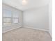 Bedroom with neutral paint, carpet, and large windows at 525 Purple Finch Rd, Summerville, SC 29486