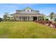 Beautiful clubhouse featuring a covered porch and well-maintained lawn at 525 Purple Finch Rd, Summerville, SC 29486