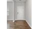 Bright entryway showcases wood-look flooring and a stylish white door with modern hardware at 525 Purple Finch Rd, Summerville, SC 29486
