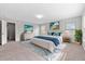 Bright main bedroom featuring plush carpeting and coastal-inspired decor at 525 Purple Finch Rd, Summerville, SC 29486