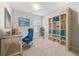 Home office featuring custom bookcase and coastal decor at 525 Purple Finch Rd, Summerville, SC 29486