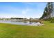 Scenic pond view with lush green surroundings and beautiful reflections at 525 Purple Finch Rd, Summerville, SC 29486