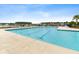 Relaxing community pool with lounge chairs on a sunny day at 525 Purple Finch Rd, Summerville, SC 29486