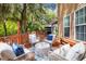 Relaxing back deck features cushioned seating and wooded views at 5471 Rising Tide, North Charleston, SC 29420