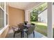 Cozy back porch featuring a table and chairs, perfect for outdoor dining and relaxation at 5471 Rising Tide, North Charleston, SC 29420