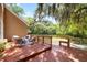 Backyard deck with outdoor seating and a view of the wooded backyard at 5471 Rising Tide, North Charleston, SC 29420