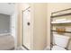 Modern bathroom with glass shower, neutral walls, and black shelving unit at 5471 Rising Tide, North Charleston, SC 29420