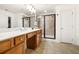 Bathroom with double sink vanity, framed mirrors, and a tiled glass shower at 5471 Rising Tide, North Charleston, SC 29420