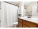 Bathroom featuring a white shower curtain, vanity and sink, and a storage cabinet at 5471 Rising Tide, North Charleston, SC 29420