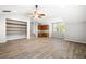 Large bonus room with attached cabinetry, shelving, wood floors, and a ceiling fan at 5471 Rising Tide, North Charleston, SC 29420