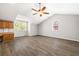 Bonus room featuring wood floors, attached cabinetry, a vaulted ceiling, and a ceiling fan at 5471 Rising Tide, North Charleston, SC 29420