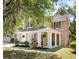 Charming home showcasing a cozy front porch, lush landscaping, and inviting curb appeal at 5471 Rising Tide, North Charleston, SC 29420