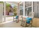 Inviting front porch with rocking chairs and decorative pillows, offering a relaxing outdoor space at 5471 Rising Tide, North Charleston, SC 29420