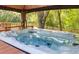 Hot tub under gazebo overlooking the backyard and woods at 5471 Rising Tide, North Charleston, SC 29420
