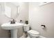Elegant powder room featuring a pedestal sink, toilet, and neutral wall color at 5471 Rising Tide, North Charleston, SC 29420