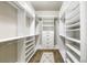 Organized walk-in closet with custom shelving and hanging rods at 5471 Rising Tide, North Charleston, SC 29420