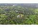 Overhead view of home secluded in a forest, showcasing the natural beauty and privacy of the property at 5950 Kelseys Mill Rd, Ravenel, SC 29470