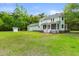 Charming home with a spacious green backyard, screened porch and balcony at 5950 Kelseys Mill Rd, Ravenel, SC 29470