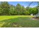 Spacious, lush backyard with a charming shed and well-manicured lawn at 5950 Kelseys Mill Rd, Ravenel, SC 29470