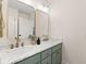 Bright bathroom featuring a double vanity with marble countertop and decorative decor at 5950 Kelseys Mill Rd, Ravenel, SC 29470
