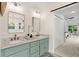 Bright bathroom featuring a double vanity with marble countertop and views into the bedroom at 5950 Kelseys Mill Rd, Ravenel, SC 29470