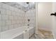 Bathroom featuring a tub and shower combination with decorative tile at 5950 Kelseys Mill Rd, Ravenel, SC 29470