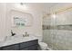 Modern bathroom features a marble vanity, sleek fixtures, and a glass enclosed shower at 5950 Kelseys Mill Rd, Ravenel, SC 29470